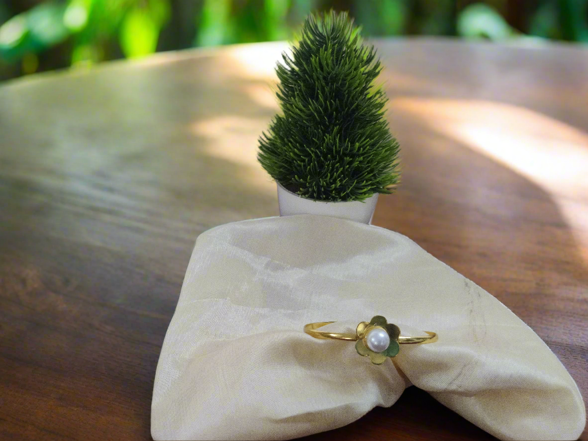 Gold ring with a green stone