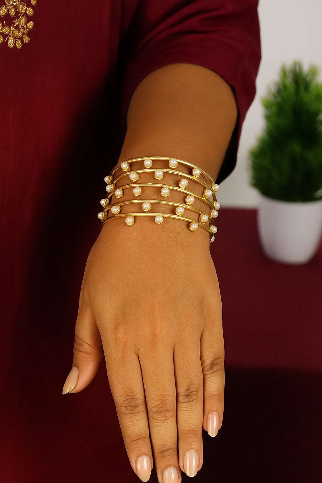 Trendy gold toned with pearl wired bracelet
